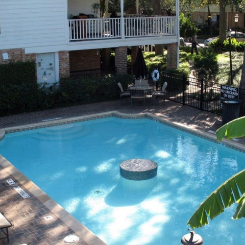 a pool with chairs around it