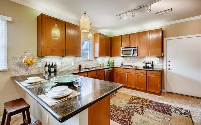 a kitchen with a marble island