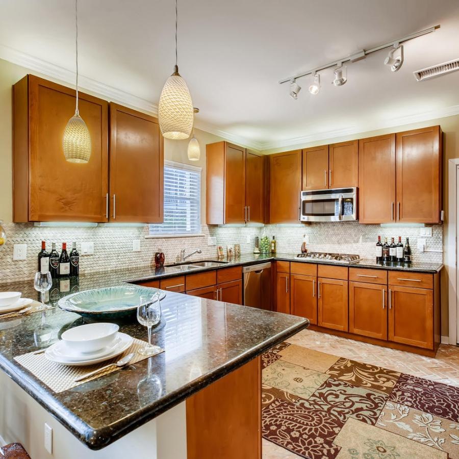a kitchen with a marble island