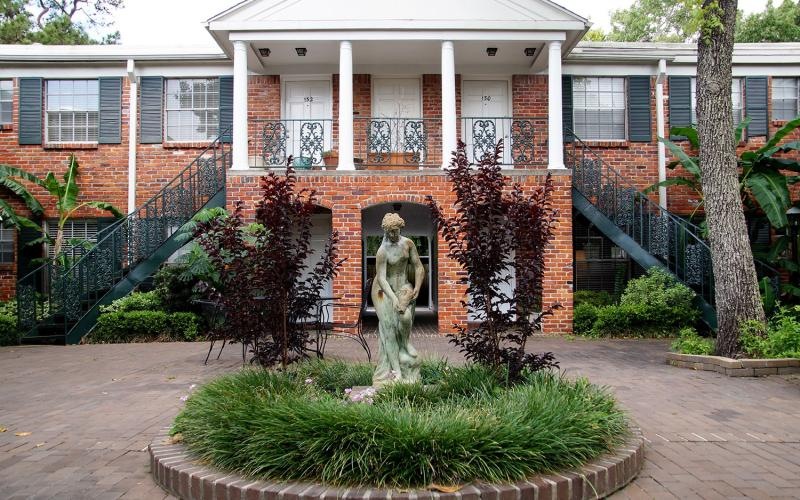 a statue in front of a building